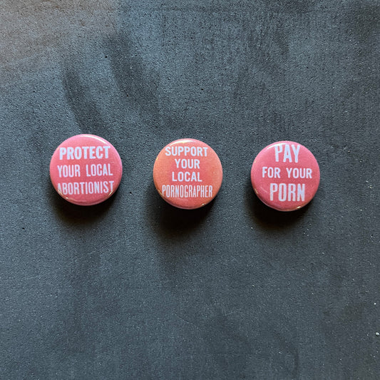 1" Buttons - Vintage Text - Pornographer / Abortionist